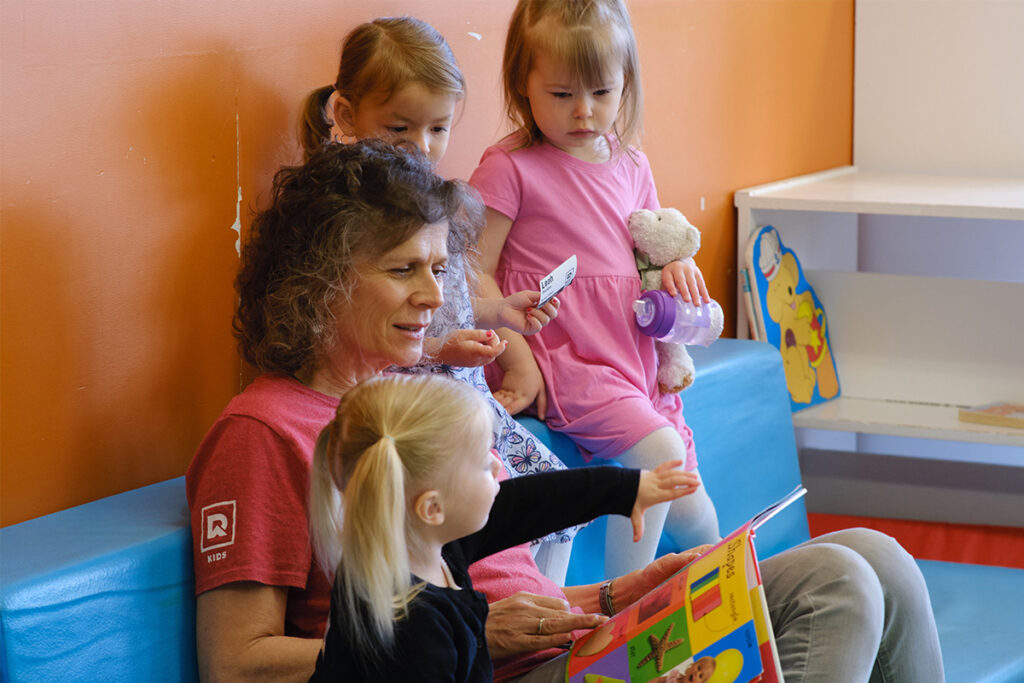 Children in Sunday school with a worker at Redemption Bible Chapel
