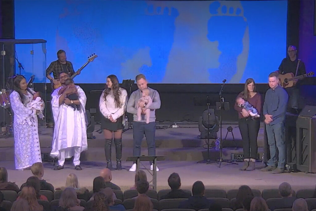 Family dedication service at Redemption Bible Chapel