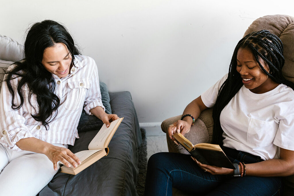 Two young people reading the Bible together