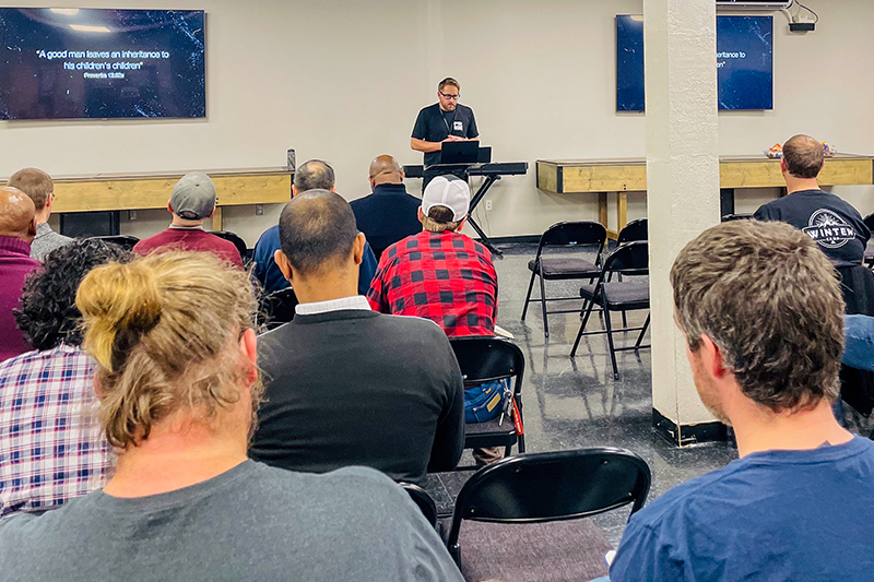 Group of people sitting and listening