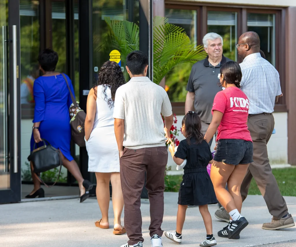 Families walking into church service