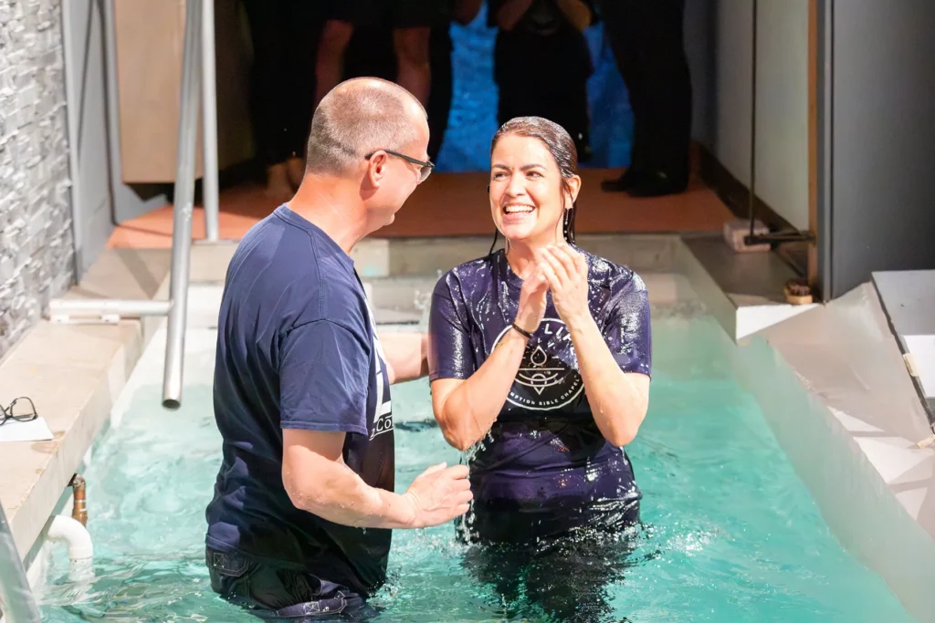 A new believer being baptized at Redemption Bible Chapel