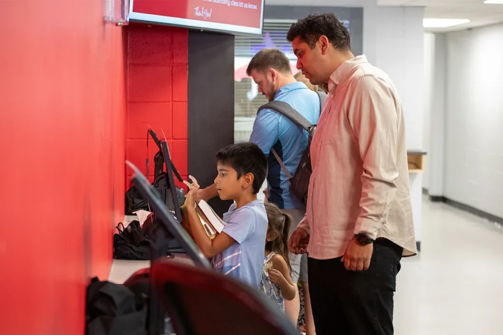 A family registering into kids ministry