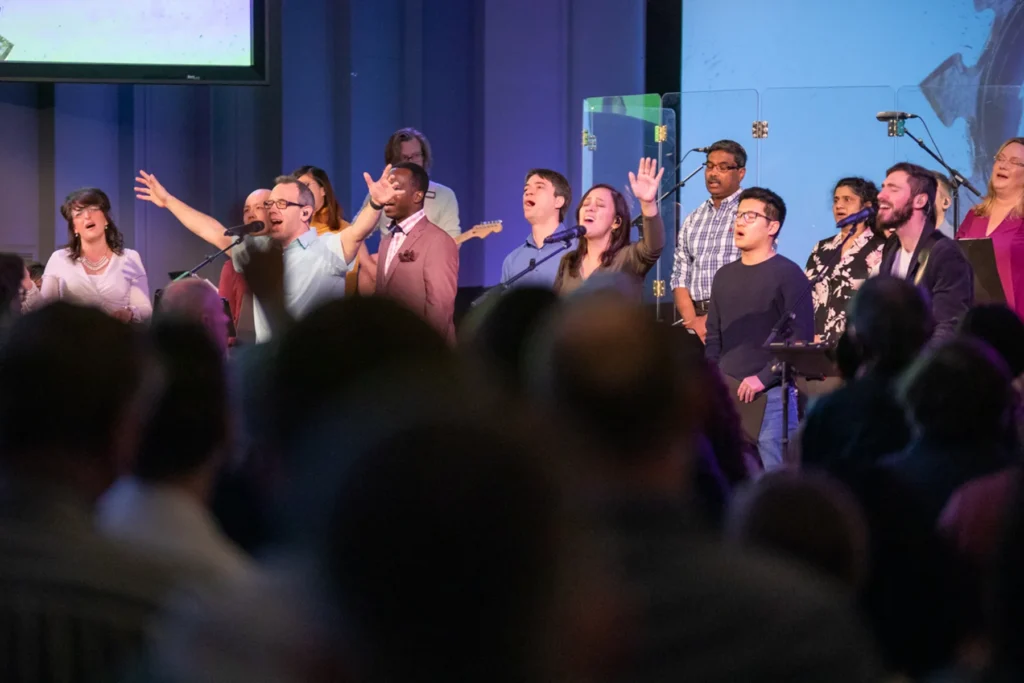 People worshipping at Redemption Bible Chapel during service