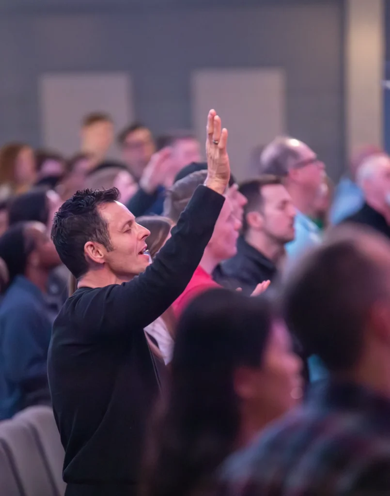 People worshiping at Redemption Bible Chapel during a Sunday morning service