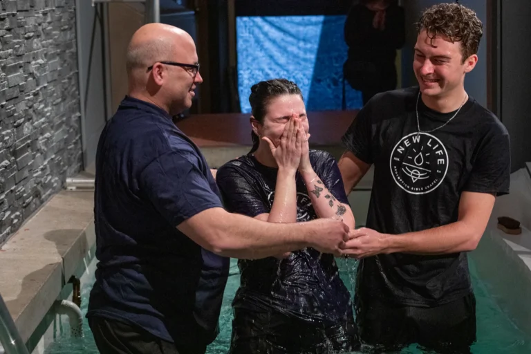 A family baptizing a member
