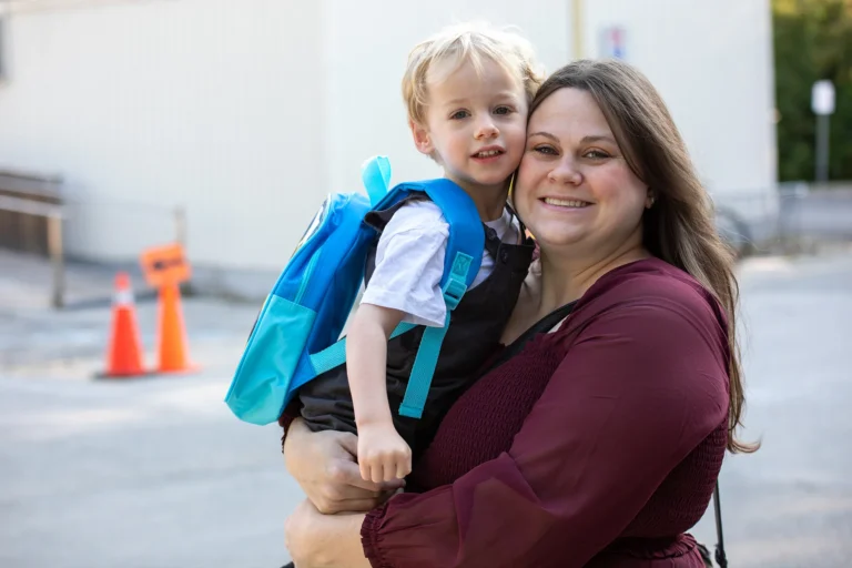 Mother and son smiling at camera