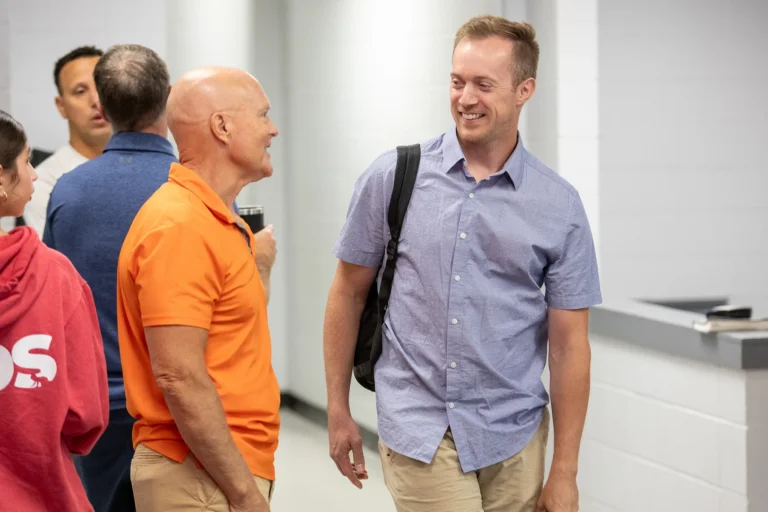 Two men talking together after church service