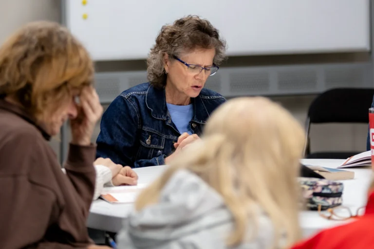 A women praying during women's Bible study