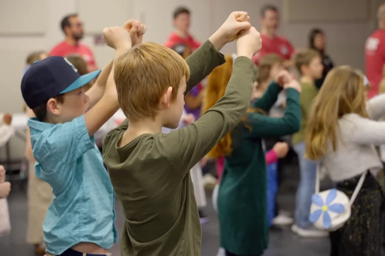Kids singing and doing actions