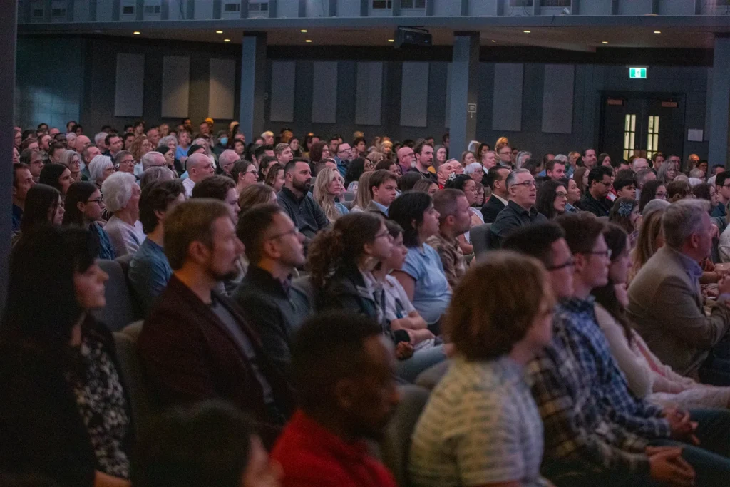 Worship centre filled with people listening to God's Word being preached