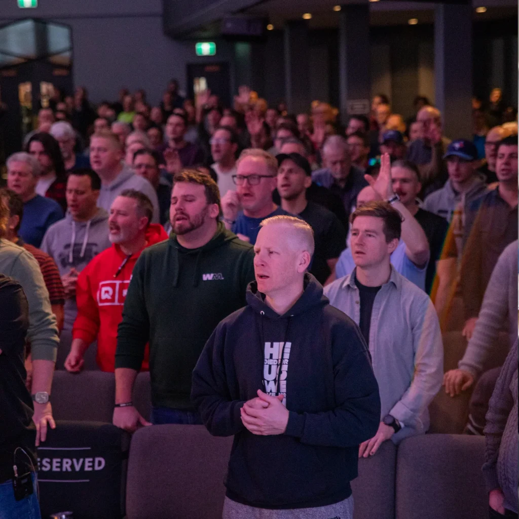 Hundreds of men worshiping the Lord together