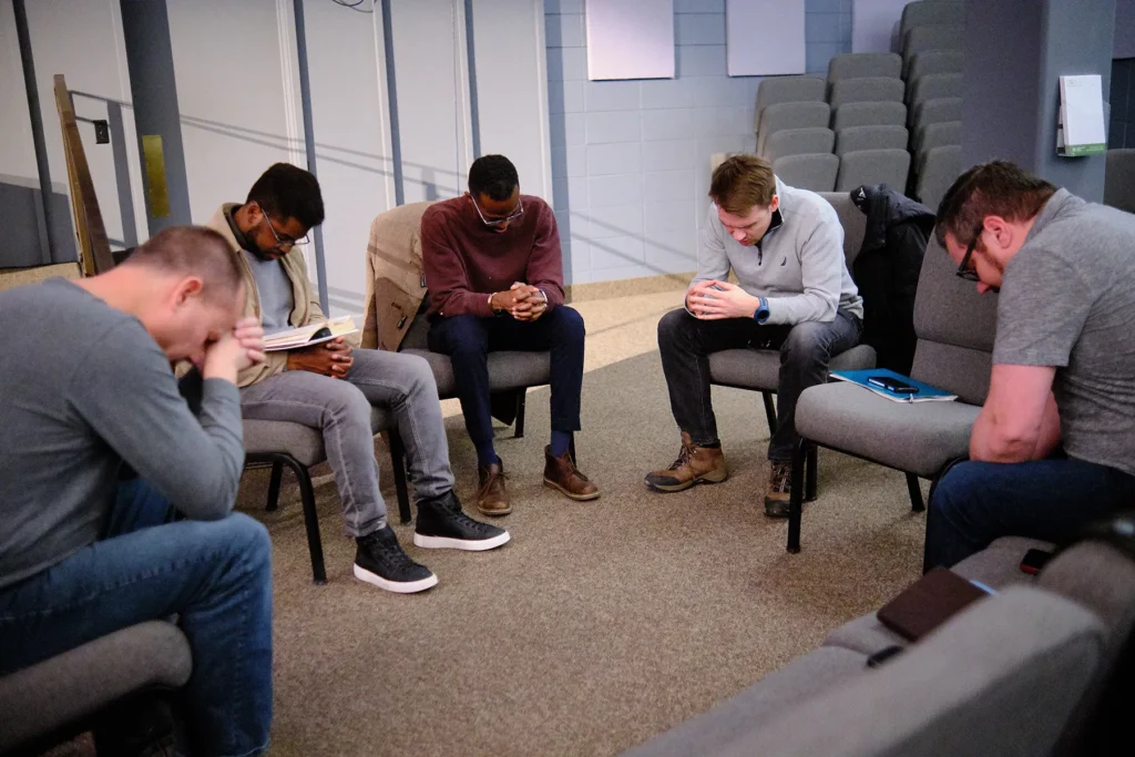Men praying together
