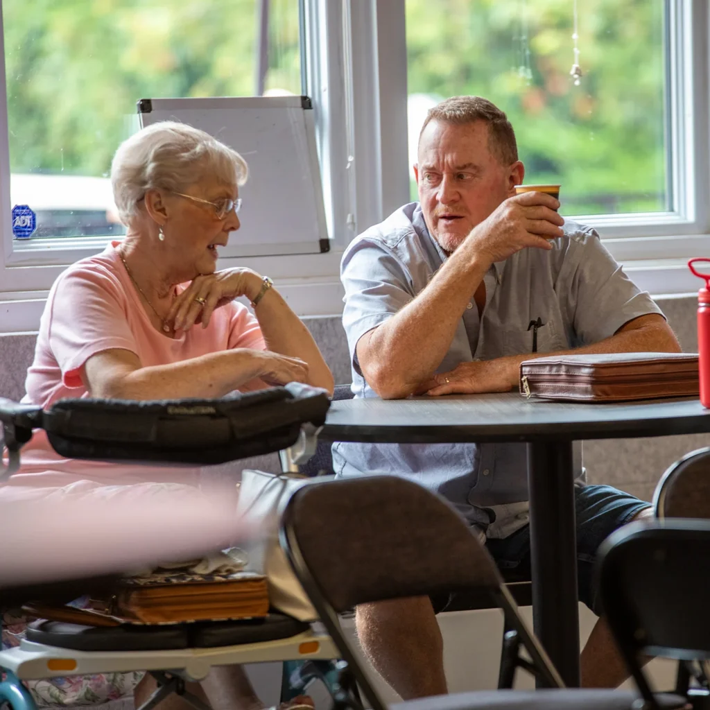 Two people sitting and talking