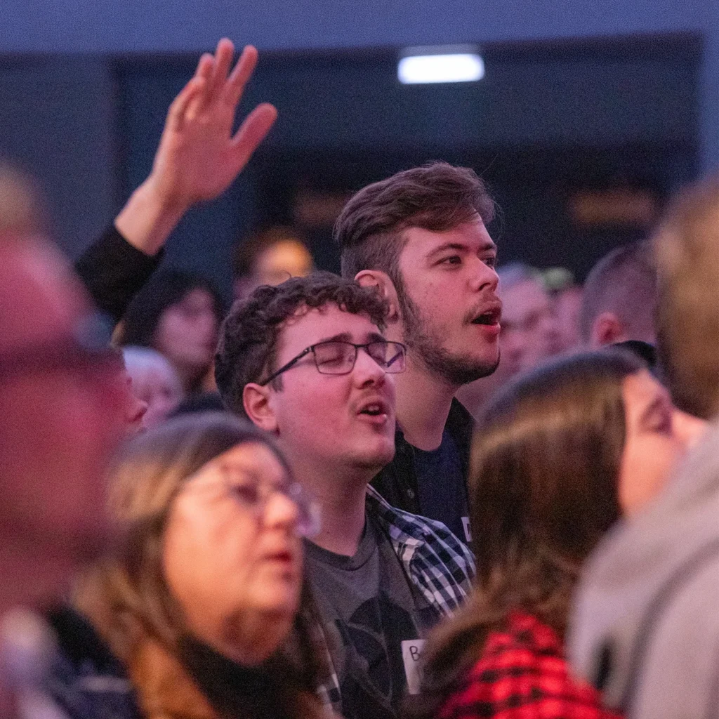 Young adults worshipping