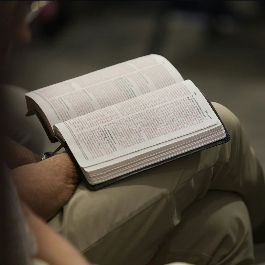 Bible on lap