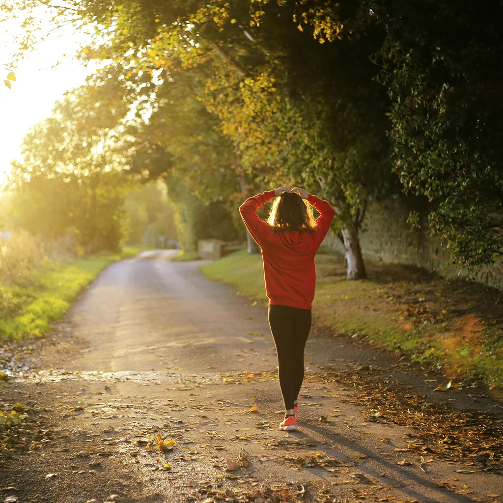 Woman walking down pathway