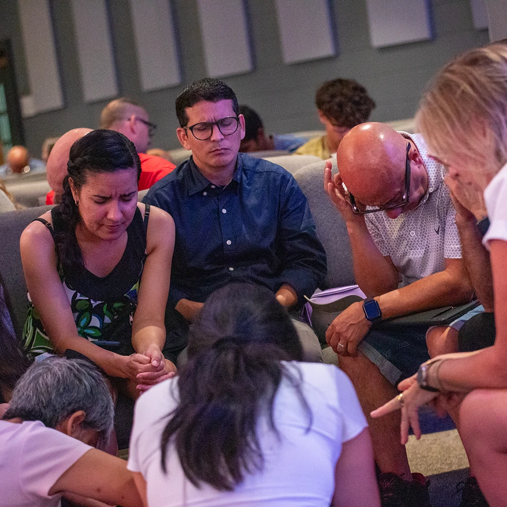 A group of people praying together